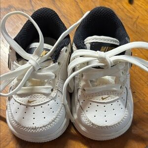 Nike Kids White Sneakers with Gold Accents